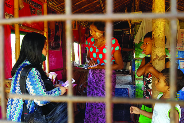 Missionary sharing the gospel with family in Myanmar