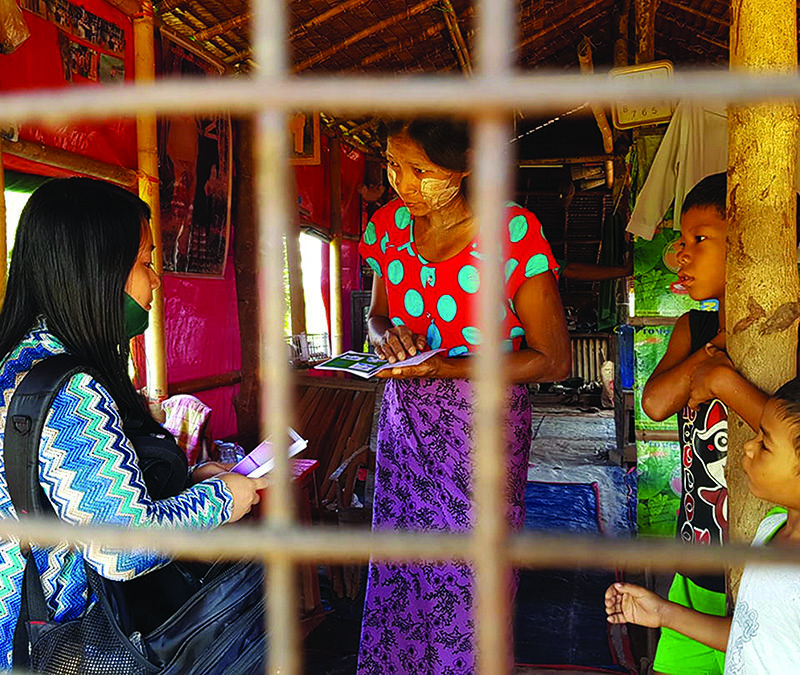 Missionary sharing the gospel with family in Myanmar